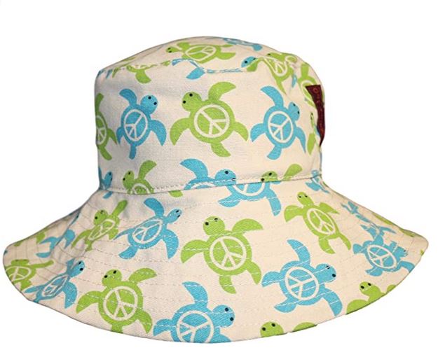 The Bungalow 360 Beach Hat Sea Turtle showcases a distinctive design featuring green and blue turtles, each with a peace symbol on their shell. Its light beige background makes it an ideal packable travel companion for sunny adventures.