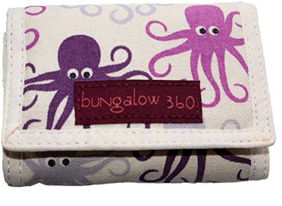 The Tri Fold Wallet Octopus by Bungalow 360 is a compact vegan canvas accessory that features distinctive designs of purple and pink octopuses with googly eyes set against a light background. It is adorned with a maroon label on the front, embroidered with "Bungalow 360," showcasing support for animal causes.