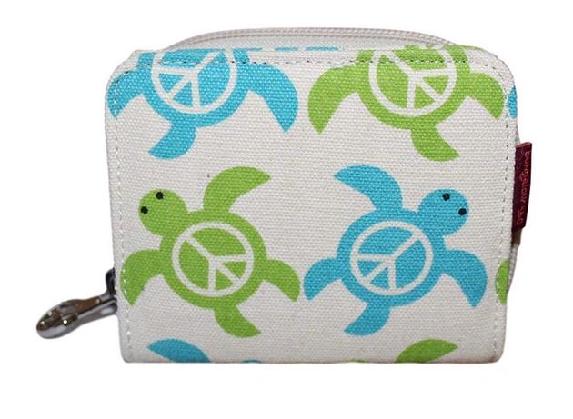 Introducing the Bill Fold Wallet Sea Turtle by Bungalow 360—a compact, rectangular wallet crafted from cotton canvas. It features a white background adorned with a charming pattern of green and blue turtles, each sporting a peace symbol on its shell. This vegan-friendly accessory boasts a zipper and a small metal clip on the left side, offering both style and eco-consciousness.