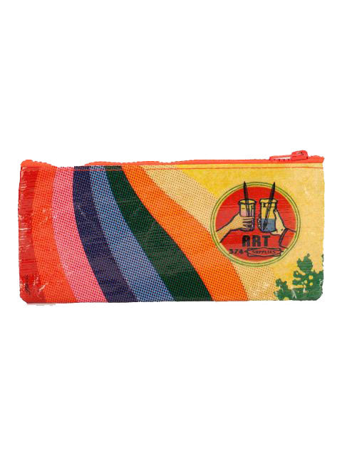 Introducing the Art Supplies Pencil Case from Blue Q! This vibrant, zippered accessory boasts an eye-catching orange border and is crafted entirely from recycled materials. The design highlights vertical arcs in a rainbow of colors—red, pink, purple, blue, green, and yellow. Adorning the case is a circular emblem featuring art supplies and the word "ART" on a bright yellow background. It's the ideal choice for setting up a travel art studio!