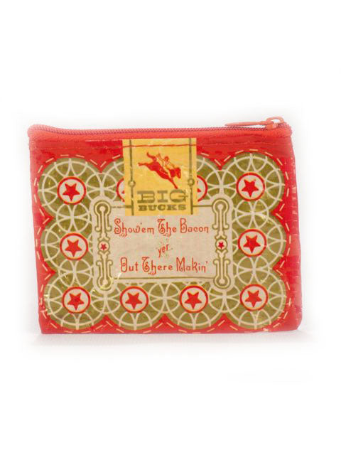 The Boss Lady Coin Purse by Blue Q is a small zippered pouch featuring a red and green geometric pattern made from post-consumer recycled material. The text on the pouch reads "BIG BUCKS" at the top, followed by "Show'em The Bacon yet But Out There Makin'." With its vintage design and red zipper, this coin purse is perfect for any boss lady.