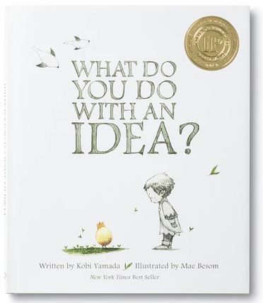 This image is the cover of COMPENDIUM's best-seller children's book, "What Do You Do With an Idea? SB4951," which features an illustration of a child gazing at a golden, round creature with tiny wings, surrounded by leaves. The book, written by Kobi Yamada and illustrated by Mae Besom, prominently displays gold award seals.