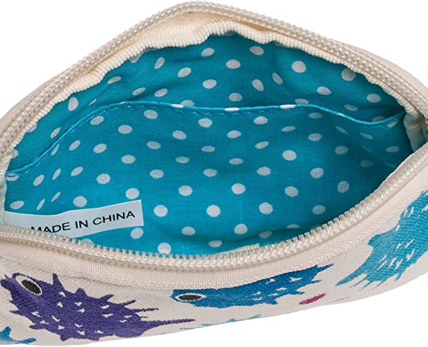 A Tiny Wristlet Puffer Fish by Bungalow 360 showcasing an interior lined with blue fabric adorned with white polka dots. The partially visible exterior reveals a beige cotton canvas fabric featuring illustrations of various colorful, spiky sea urchins. Inside the wristlet, a "Made in China" label is present.