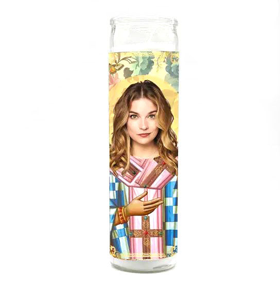 The Alexis Rose Candle by BOBBYK BOUTIQUE showcases a woman with long hair dressed in vibrant robes, positioned against an ornate floral background, creating a religious, saint-like look.