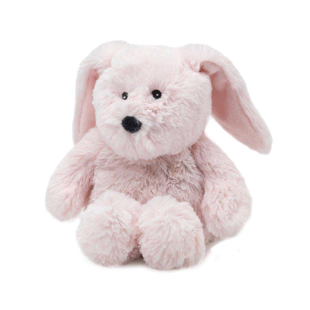 The Bunny Junior Warmies by Warmies is a fluffy, pale pink stuffed toy resembling a bunny with long ears, black button eyes, and a small, round black nose. Sitting upright against a plain white background, this adorable bunny emits a soothing lavender scent for a warm and cozy experience.