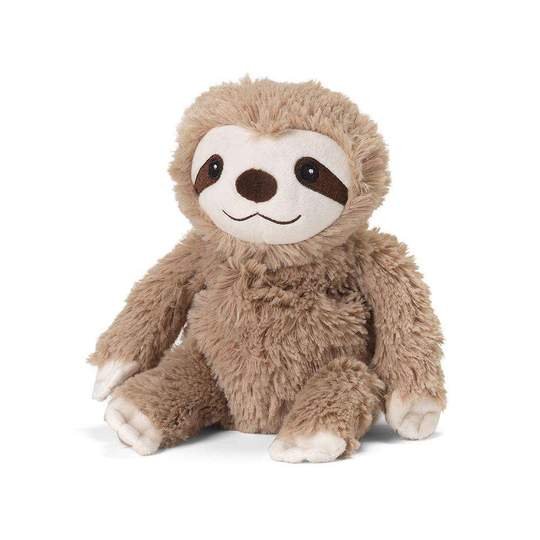 The Sloth Junior Warmie by Warmies is a plush toy shaped like a sloth. It sits upright with a fluffy brown body, white face, and dark eyes, smiling warmly. Its extended arms and legs exude relaxation, releasing a soothing lavender scent when warmed in the microwave.