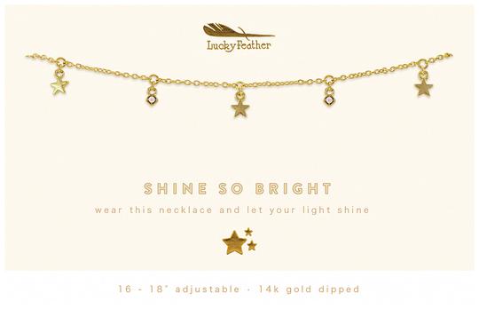 A gold dangle necklace featuring star and diamond-shaped charms is showcased, accompanied by the text "LuckyFeather" and "SHINE SO BRIGHT: wear this necklace and let your light shine." This adjustable accessory measures 16-18" and is elegantly 14k gold plated.