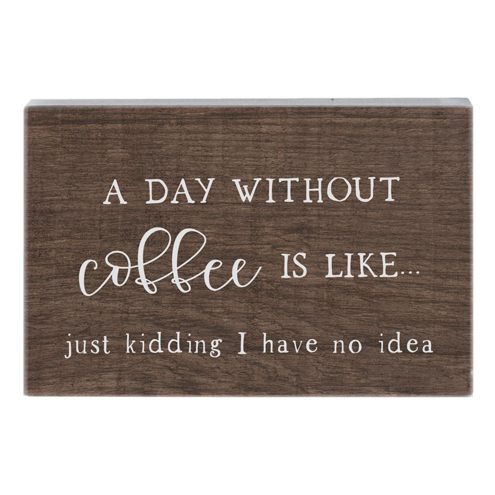 SincereSurroundings presents the "Day Without Coffee" handcrafted wooden sign, featuring a humorous white text that says, "A day without coffee is like... just kidding, I have no idea." Perfect for effortless display, this delightful piece adds a touch of humor to any Rock Rapids home.