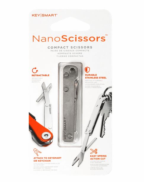 The KeySmart NanoScissors packaging highlights compact, retractable scissors constructed from durable stainless steel. Featuring an easy spring-action cut, these innovative scissors can attach to a KeySmart or keychain. The packaging underscores the product's portability by illustrating it beside keys and a keychain.