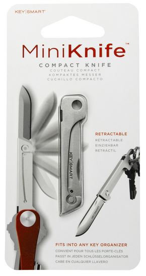 Packaging of the KeySmart Mini Knife from KeySmart. This compact folding knife features a retractable silver blade, designed to integrate seamlessly into any key organizer. The front of the packaging emphasizes the knife's notable features, including its retractability and efficiency in handling various cutting tasks, while ensuring it fits perfectly with key organizers.