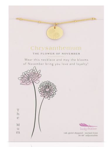 The "Birth Flower November Mum" necklace by LuckyFeather is shown on a white card. The card reads, "Chrysanthemum, the flower of November. Wear this 14k gold-dipped necklace and may the blooms of November bring you love and loyalty!" Two drawn chrysanthemums adorn the bottom left corner.