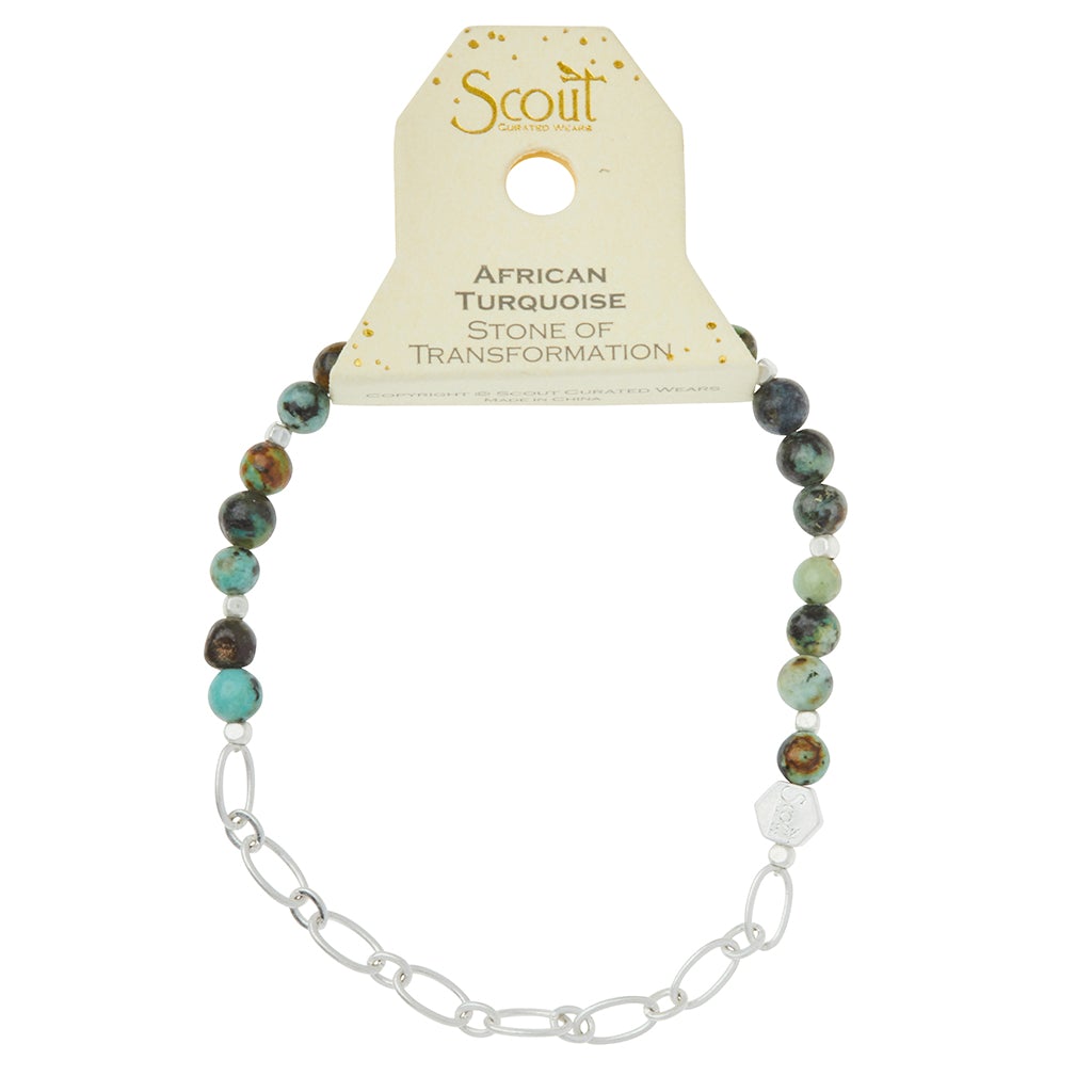 The Scout Jewelry Chain Bracelet African Turq/Silver showcases African turquoise semi-precious gemstones on a silver paperclip chain, tagged as "Stone of Transformation.