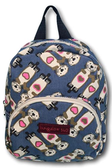 The Bungalow 360 Mini Back Pack Sea Otter is a charming blue backpack adorned with a cute pattern of otters holding pink hearts. Made from durable natural cotton canvas, it includes a front zipper pocket, an adjustable nylon strap, and a convenient top carrying handle.