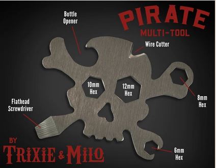 The Pirate Multi-Tool 7-in-1 by TrixienMilo, designed like a skull, includes 7 different functions such as a bottle opener, wire cutter, flathead screwdriver, and various hex wrenches (10mm, 12mm, 8mm, 6mm). The text "PIRATE MULTI-TOOL" and "By Trixie & Milo" are displayed in a stylized font. Perfect.